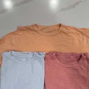 THREE American Eagle Outfitters Short Sleeve Tees - Peach, Light Blue, and Coral